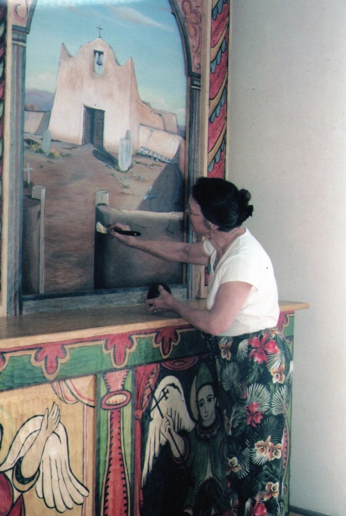 Clare Villa, curator and artist, paints the Pueblo mission of Santa Clara in the Missions of the Rio Arriba series.